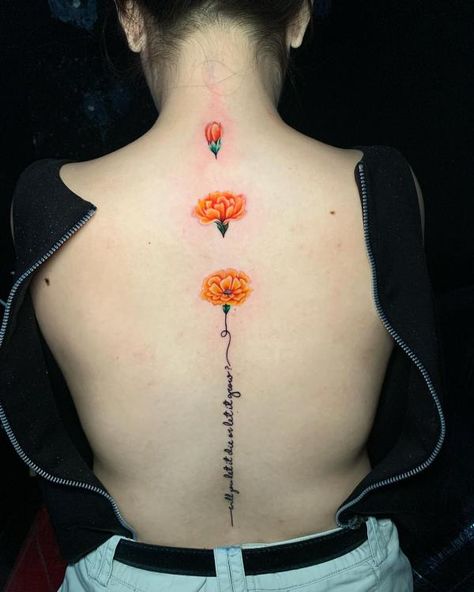 Marigold with words spine tattoo Marigold Back Tattoo, Words Spine Tattoo, Marigold Tattoos, Tattoo Designs With Meaning, Marigold Tattoo, Designs With Meaning, Clavicle Tattoo, Meaning Art, Daisy Tattoo