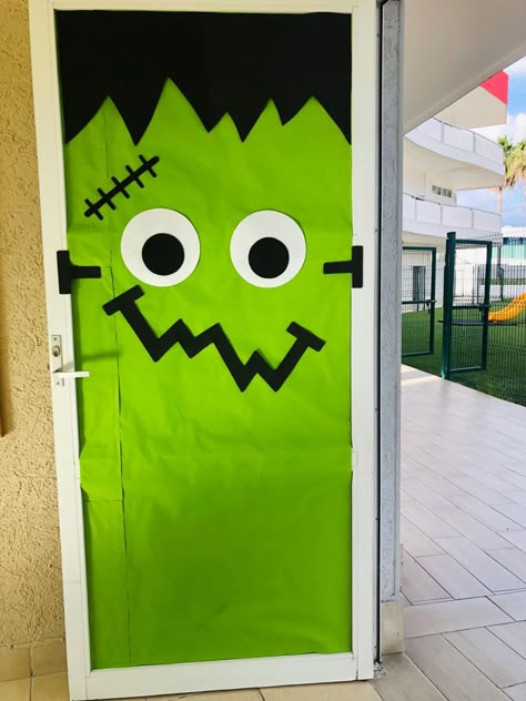 Haloween Door Frankenstein Frankenstein Window Art, Frankenstein Diy Decor, Frankenstein Door Decorations For School, Frankenstein Classroom Door, Easy Halloween Classroom Door Ideas, Frankenstein Bulletin Board, Halloween Classroom Door Decorations Ideas, Halloween Office Door Ideas, Easy Halloween Door Ideas