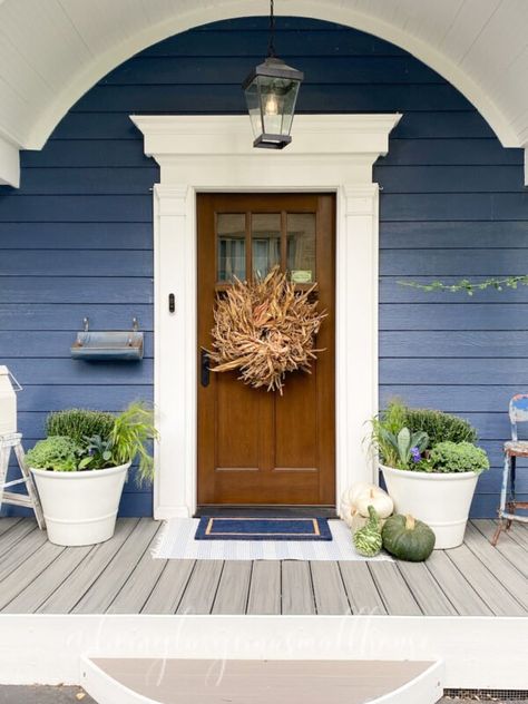 Navy House Wood Door, Blue House Wood Door, Blue House Exterior With Wood, Blue House White Trim, Simple Fall Porch, Simple Fall Porch Decor, French Country Cottages, Light Blue Houses, Dark Blue Houses