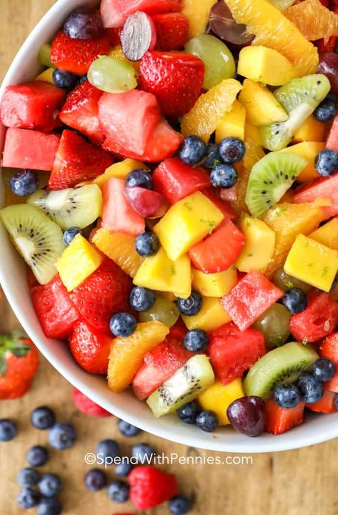 This fresh fruit salad combines all our favorites into one juicy flavorful colorful dish. With watermelon, strawberries, raspberries, blueberries, kiwis, grapes, oranges and mango this salad is sure to satisfy your fruit craving! #spendwithpennies #fruitsalad #freshfruit #summersalad #fruitcocktailsalad #dessert Mexican Fruit Salad, Fruit Cocktail Salad, Fruit Salad Dressing, Watermelon Fruit Salad, Mexican Fruit, Honey Lime Dressing, Dressing For Fruit Salad, Fruit Salad Easy, Summer Salads With Fruit