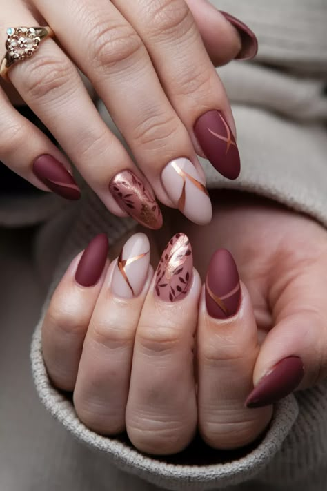 Embrace the cozy spirit of autumn with these chic dip nails that perfectly capture the essence of the season. Picture rich burgundy shades swirling with gold sparkles, creating a warm and inviting look that nods to falling leaves. This stunning style is the ideal balance of elegance and trendiness, making it a perfect choice for any fall occasion. Don窶冲 miss out on these fabulous fall nail ideas! Autumn Nails Oval, Oval Acrylic Nails, Burgundy Shades, Oval Nails Designs, Autumn Florals, Nails Autumn, Fall Nail Ideas, Sweater Nails, Acrylic Nail Ideas