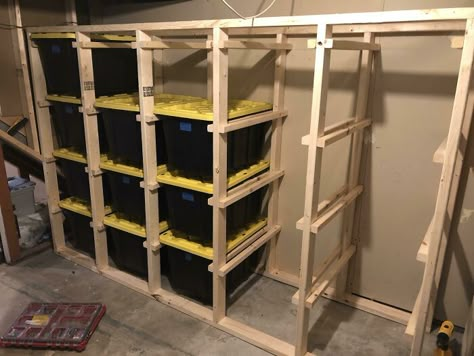 I Standardized All My Storage Bins But Got Tired Of Unstacking/Restacking Every Time I Needed Something From The Bottom Bin. I Built This Rack So Each Bin Can Slide Out, And It Wastes Very Little Storage Space. What Do You Think? Slide Out Storage Bins, 2x4 Garage Storage, Floating Bin Storage, Shed Interior Ideas Storage, Attic Bin Storage, Totes Storage Shelves, Black And Yellow Tote Storage, Costco Bin Storage, Storage Shelves For Totes