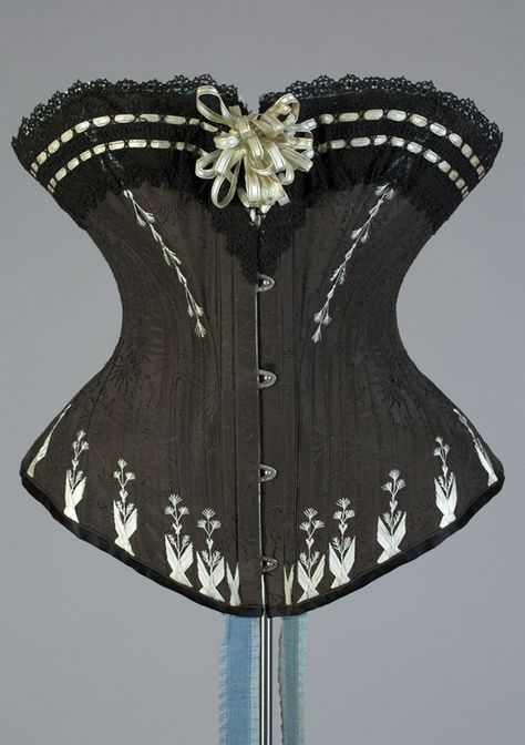 Black corset trimmed with pale blue flossing and ribbons, Polish, 1880s, KSUM 1983.1.1500 Edwardian Corsets, 1880s Fashion, Kent State University, Victorian Corset, Kent State, 19th Century Fashion, Vintage Corset, Corsets And Bustiers, Retro Mode