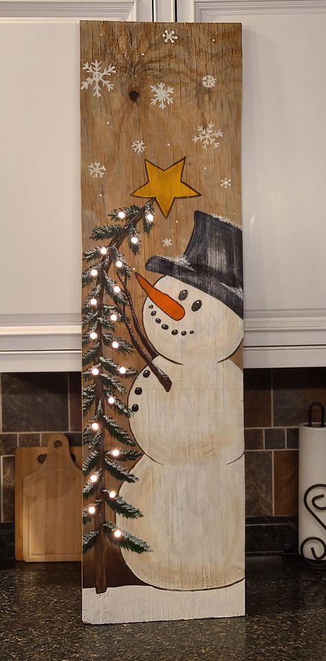 Barn Board Christmas Projects, Snowman Painted On Wood Board, How To Paint A Snowman On Wood, Wood Plank Signs Diy, Paint Snowman On Wood, Wood Plank Christmas Crafts, Winter Signs Wooden Diy, Wood Painting Christmas, Painting Boards Ideas Wood Signs