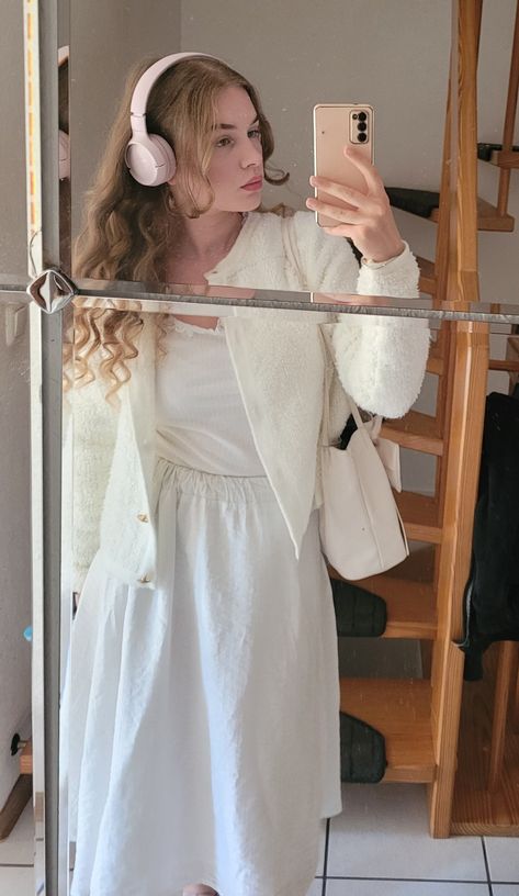 white, white outfit, modest, long skirt, modest outfit, whitecore, coquettecore, coquette, coquetteoutfit, coquette aesthetic, brown hair, brown curls, headphones, curly hair, fit check, mirror selfie, cardigan, blouse, feminine, femininity, girly, fashion, make up Silky Dress, White Cardigan, White Skirts, White Bag, Winter Coat, My Pictures, White Dress, Instagram Photo, Photo And Video