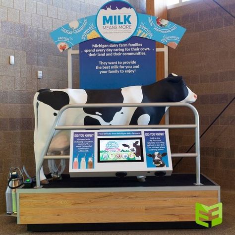 Statue of a cow on an exhibit that includes a milking machine and signage explaining how automatic milking machines work. Agriculture Exhibition, Exhibitions Ideas, Milking A Cow, Entrance Portal, Milking Cow, Cow Sculpture, Frisian Flag, Milk Store, Milking Machine