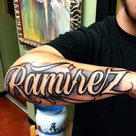 Last Names Tattoos On Arm, Negative Name Tattoo, Letters For Tattoos Fonts, Shading Around Name Tattoo, Chavez Tattoo Name, Last Name Arm Tattoo, Sanchez Tattoo Last Name, Negative Shading Tattoo Letters, Tattoo Names On Arm