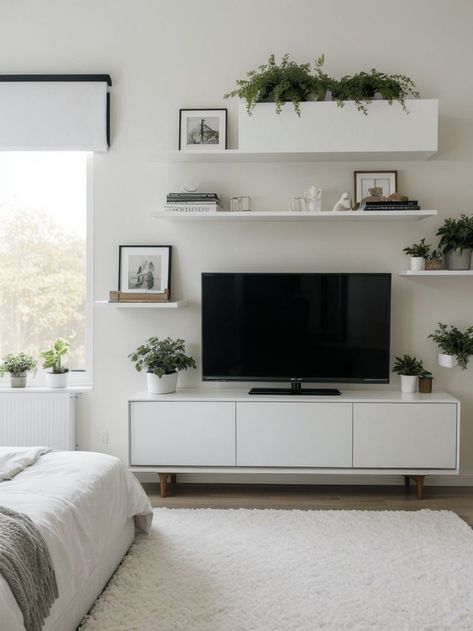 Create an aesthetically pleasing TV unit for your bedroom by incorporating a sleek, minimalist design with floating shelves and a glossy white finish. Add some greenery with potted plants as decor, and complete the look with a cozy faux fur rug for added comfort. Plants As Decor, Stylish Tv Unit, White Units, Faux Fur Rug, Fur Rug, Tv Unit, Glossy White, Aesthetically Pleasing, Potted Plants