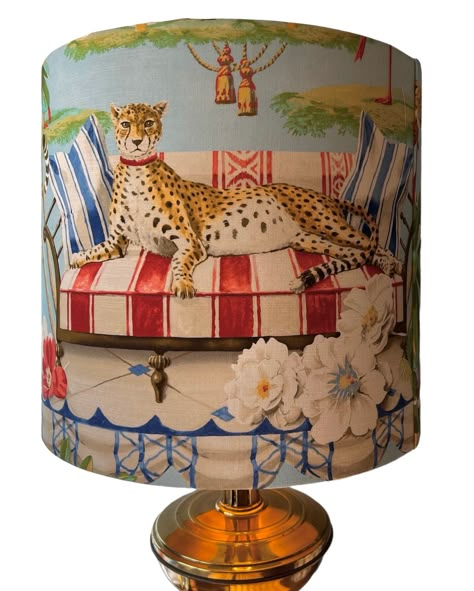 This beautiful lampshade has been covered in a stunning Harrison Howard fabric featuring cheetahs, flamingos and lots of fauna and flora. It is sure to  make a statement in any room.  Handmade in beautiful Greenville, SC. All lampshades have a single seam and rolled edges. Please note that the pattern placement can vary however I try my best to ensure optimal placement each time. The pattern will not always match up at the seam. The shape of the shade is a drum shape which means the top and bott African Airbnb, Weird Lamps, Bedroom Sconces Bedside, Parrot Lamp, Decoupage Lampshade, Lamp Upcycle, Harrison Howard, Flamingo Lamp, Crane Lamp