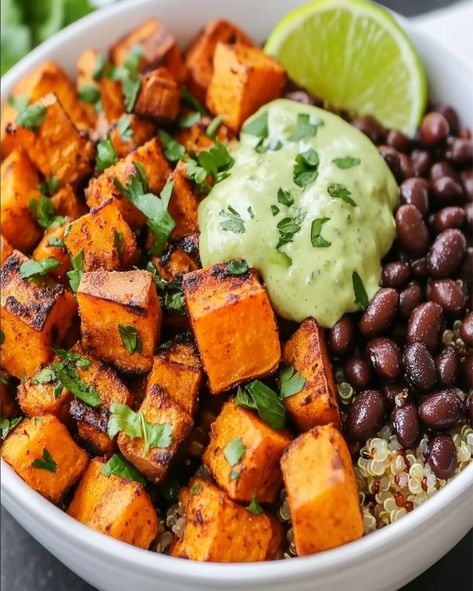 Learn how to make Sweet Potato and Black Bean Quinoa Bowls in just 30 minutes! A delicious, healthy, and filling meal perfect Quinoa And Sweet Potato Bowl, Sweet Potato Black Beans Quinoa, Sweet Potato Black Bean Recipes Healthy, Sweet Potatoes With Black Beans, Quinoa Recipes With Sweet Potatoes, Black Bean Stuffed Sweet Potato Recipes, Black Bean And Sweet Potato Bowl, Black Beans And Quinoa Recipe, Sweet Potato Edamame Bowl