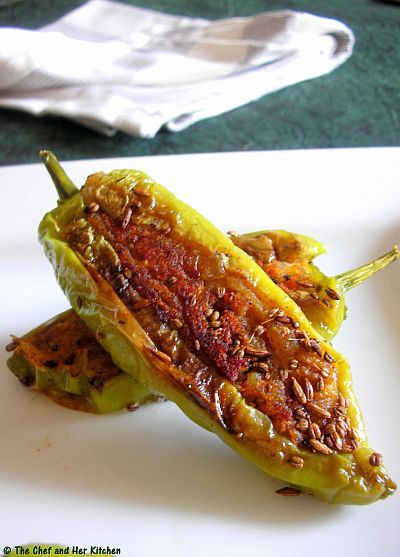 Aloo Stuffed Chilli Peppers | Bharwa Mirch 8-10 long thick light Green chillies/Poblano peppers(bajji variety with less spice)  4 Potatoes,boiled and peeled  2 tbsp besan  1 Onion,finely chopped  2-3 tbsp chopped Coriander  1/2 tsp Red chili powder  1/2 tsp Garam masala  1/2 tsp Coriander powder  1/2 tsp Amchur powder  1 tsp Lemon juice  1 tsp Saunf  1 tsp Jeera  1/2 tsp Ajwain  a pinch of hing  Oil to shallow fry  Salt to taste Stuffed Chillies Recipe, Aalu Bhajiya, Desi Khana, Veg Curry, Poblano Peppers, Chilli Peppers, Chilli Recipes, Desi Food, Red Chili Powder