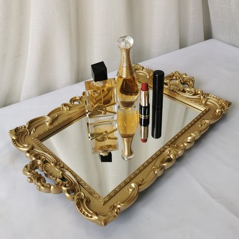 PRICES MAY VARY. MULTI-FUNCTIONAL TRAY: Perfect mirrored vanity tray for jewelry, accessories, perfumes, makeup, skin care product organizing, and also an ideal serving tray (avoid direct touch to foods). BEAUTIFUL FRENCH STYLE - The french style mirror tray is featuring with floral patternmakes, it a stunning and elegant accent for living room, bathroom and wedding party. it's also an excellent choice for Baroque, Rococo and any other antique decor. DETAIL DESIGN: With size about 9.5”x 14.9”, r French Style Makeup, Gold Bathroom Fixtures, Bathroom Decor Modern Luxury, French Style Mirrors, Gold Room Decor, Gold Bathroom Decor, Black Bathroom Decor, Black And Gold Bathroom, Modern Luxury Bathroom