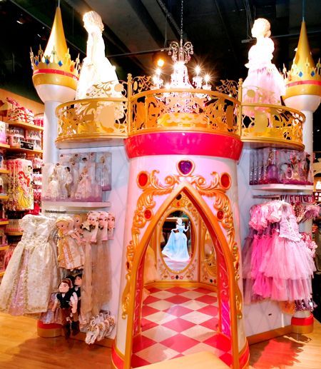 This castle is featured in most newer Disney retail stores, this is usually where princess dresses can be found along with the more feminine kids collections Disney provides. go inside the castle and visit some of your favorite princesses. this makes the shopping visit more of an experience, and a bit more magical. Abbey Obernberger Toy Store Design, Ala Moana Center, Early 2000s Aesthetic, Princess Theme Birthday, Moving To Hawaii, Mall Stores, Store Interiors, Toy Display, Princess Theme