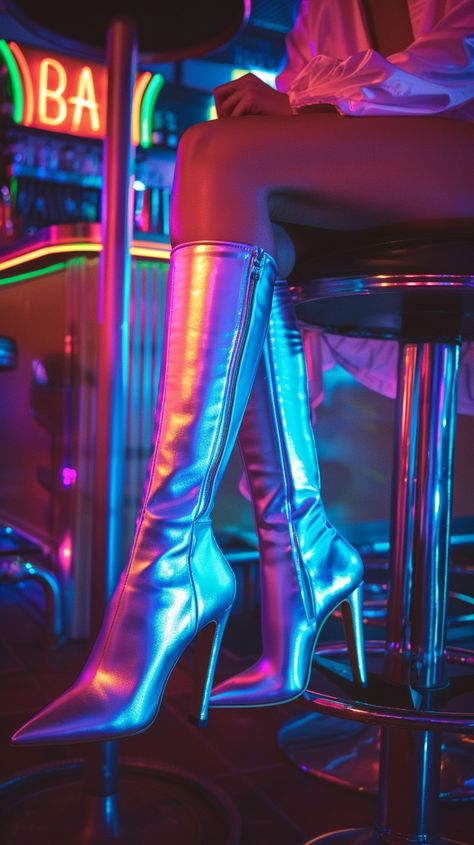 Chic Metallic Boots: Stylish person sitting on a bar stool showcases shimmering metallic boots under vibrant neon lights. #fashion #nightlife #boots #metallic #neon #aiart #aiphoto #stockcake ⬇️ Download and 📝 Prompt 👉 https://stockcake.com/i/chic-metallic-boots_968784_972119 Metalllic Boots, Luxury Metallic Party Boots, Streetwear Ankle-high Platform Boots With Metal Feet, Neon Boots, Cyberpunk Fashion Neon, Party Platform Ankle-high Boots With Metal Feet, Pink Stiletto Heels, Red Stiletto Heels, Metallic High Heels