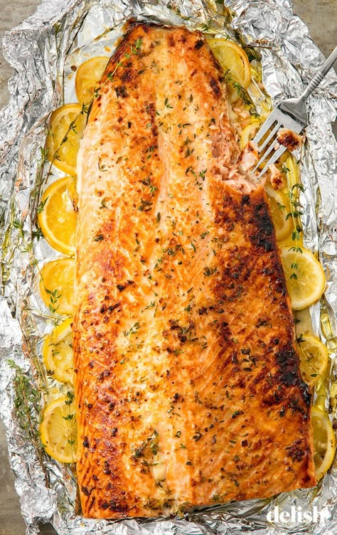 Garlic-Butter Baked Salmon = The Easiest Way To Feed A CrowdDelish Oven Baked Salmon Recipes, Salmon Dinner Recipes, Lemon Pepper Salmon, Salmon In Foil, Fish Recipes Baked, Garlic Butter Salmon, Oven Baked Salmon, Butter Salmon, Baked Garlic