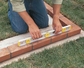 Brick Garden Wall, Reclaimed Brick Garden, Pouring Concrete Slab, Building A Brick Wall, Brick Wall Gardens, Diy Brick Wall, Brick Face, Brick Laying, Brick Interior