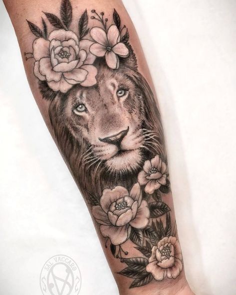 amazing lion tattoo with flowers | realism tattoo | black & gray tattoo #chesttattoo #tattooforwomen Lion With Flowers, Lion Tattoo With Flowers, Female Lion Tattoo, Lion Forearm Tattoos, Gray Tattoo, Lioness Tattoo, Lion Tattoo Sleeves, Lion Head Tattoos, Girl Arm Tattoos