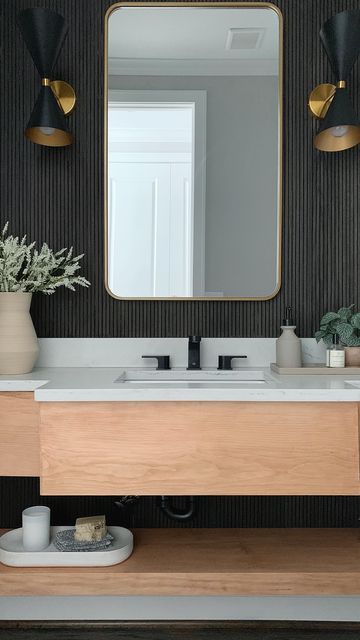 Kimberly | Interior Designer on Instagram: "🍋 The Pole Wrap wall went viral but the vanity I built is my favorite part of this powder room renovation! What about you? #diyhome #bathroomremodel #bathroomrenovation #bathroomdecor #powderroomdesign #powderroom #housegoals #ａｅｓｔｈｅｔｉｃ #howihome #diyprojects #diyideas" Powder Room Slat Wall, Black And Wood Powder Room, Wood Panel Powder Room, Slatwall Bathroom, Slat Wall Powder Room, Powder Room Wall Paneling, Tile Powder Room Wall, Powder Room Tile, Black Powder Room