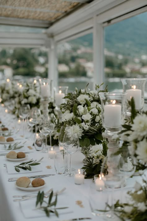 Green and white flower garlands and candles for a Romantic Italian Wedding at Lake Como. Images by Paola Colleoni Romantic Italian Wedding, Pale Blue Dress, Wedding At Lake, Romantic Italian, Pale Blue Dresses, Green Themed Wedding, White Wedding Theme, Lake Como Wedding, Wedding Table Settings