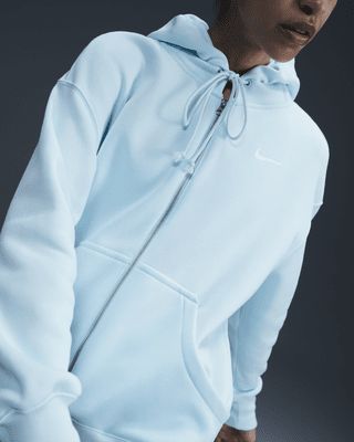 Grounded in style, comfort and versatility, meet our take on luxury loungewear. This zip-up hoodie helps you stay cozy all day long, thanks to midweight fleece that feels soft yet structured. Plus, exaggerated details (like the oversized pocket and taller ribbing) give you a trend-right look. Shown: Glacier Blue/Sail Style: DQ5758-474 Nike Sportswear Phoenix Fleece, Luxury Loungewear, Loungewear Luxury, Blue Nike, Nike Hoodie, Full Zip Hoodie, Stay Cozy, Nike Sportswear, Zip Up