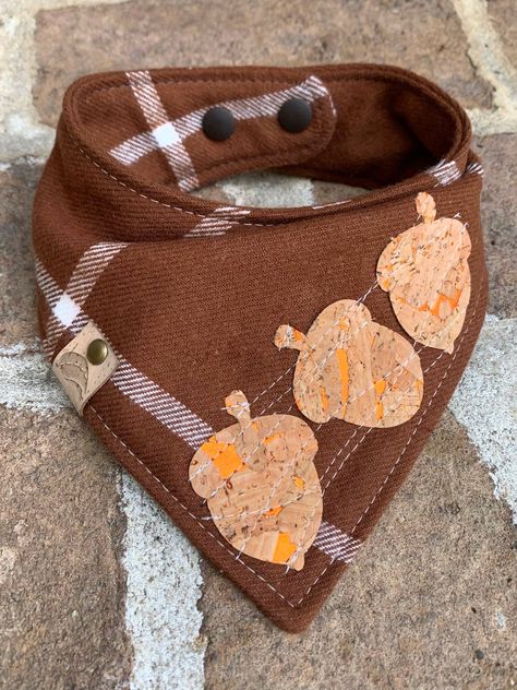 A high quality 100% cotton plaid bandana for your fur baby! A classy harvest plaid bandana whimsically stitched with 3 cork acorns. Let him or her stand out among the dogs Perfect for thanksgiving, pumpkin farm visits or any fall pictures.  I love this bandana! Machine wash and tumble dry. Do not iron over the cork. NECK SIZE OPTIONS: X-small up to 10" Small 11-13" Medium 14-16" Large 17-19" X-large 20-22" XXL 23"-25" When ordering, please leave me a message in the "note to seller" section at checkout with your pets neck size This is a high quality bandana with two layers of cotton and a middle layer of flannel to allow it to drape beautifully on your dog.  All my bandanas are topstitched for extra durability and a snap closure or tie on for easy on and off.  To finish it off, my faux leat Dog Sewing Patterns, Orange Dog, Dog Thanksgiving, Diy Sewing Gifts, Dog Bandanna, Puppy Bandana, Dog Clothes Diy, Pumpkin Farm, Fall Dog