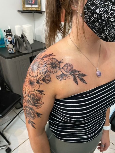 Shoulder And Arm Flower Tattoo, Shoulder Tattoos For Women Half Sleeves, Arm And Collar Bone Tattoo, Women's Shoulder Tattoos Ideas, Shoulder Cap Half Sleeve Tattoo, Floral Shoulder And Arm Tattoo, Daisy Tattoo Shoulder Cap, Women’s Front Shoulder Tattoo, Women Shoulder Neck Tattoo