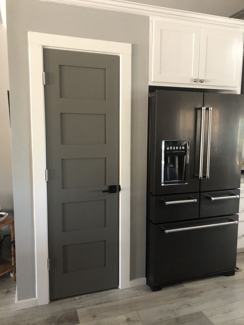 Dark Grey Farmhouse, Dark Gray Interior Doors, Gauntlet Grey, Dark Interior Doors, Dark Gray Interior, Grey Walls White Trim, Gray Interior Doors, Kitchenaid Appliances, Interior Door Colors