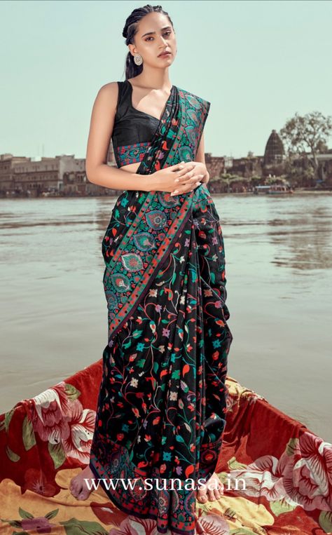 Woman standing on boat wearing black Kashmiri silk embroidered saree blouse in black color. Embroidery Saree Blouse Designs, Kashmiri Silk Saree, Kashmiri Saree, Black Pashmina, Pashmina Saree, Traditional Party Wear, Pola Blus, Designer Blouses Online, Silk Sarees Online Shopping