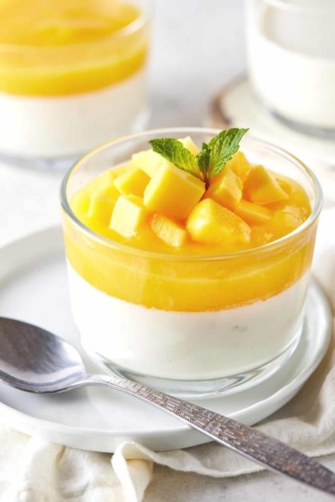 A classic Italian recipe gets a tropical spin in this decadent Mango Panna Cotta. Rich & creamy custard is paired with ripe, juicy mango for a simple, make ahead dessert that everyone loves. Mango Panna Cotta Recipe, Desserts At Home, Mango Panna Cotta, Mango Coulis, Panna Cotta Recipe, Mango Sauce, Italian Dessert, Make Ahead Desserts, Black Bee