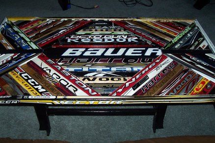 Hockey Stick Coffee Table #3 Canadiana Decor, Man Cave Bar Diy, Hockey Stick Furniture, Hockey Locker, Hockey Stick Crafts, Hockey Man Cave, Bottles Of Alcohol, Stick Furniture, Stick Projects