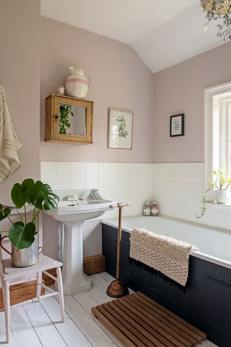 Pale pink walls, navy bath and vintage touches create a soothing tone to this bathroom. #georgian #georgianhome #homes #interiors #georgiancottage #cottage #interiors #interiorstyle #bathroom #bath #pinkbathroom Cottage Bathroom, Bathroom Color, Rustic Bathrooms, Georgian Homes, Upstairs Bathrooms, Pink Bathroom, Bath Room, Bathroom Colors, House Bathroom