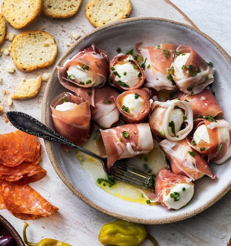 Prosciutto-Wrapped Mozzarella Balls Appetizer | Yankee Magazine Prosciutto Wrapped Mozzarella, Mozzarella And Prosciutto Appetizers, Mozzarella Prosciutto Appetizer Recipes, Prosciutto Wrapped Cheese, Mozzarella Ball Appetizers, Mozzarella Appetizer Ideas, Seasoned Mozzarella Balls, Mozzarella Recipes Appetizers, Mozzarella Balls Appetizers