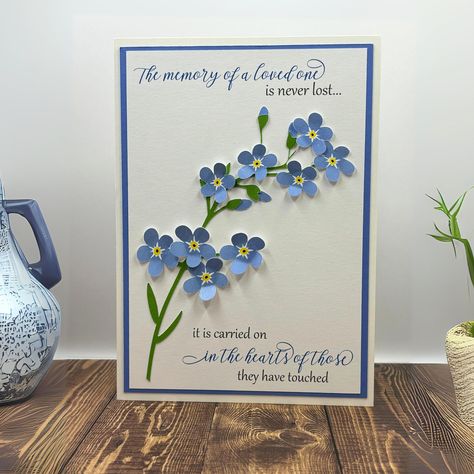 Size A7 (5 x 7 inches) Loss of a Loved One Sympathy Card with Envelope This handmade greeting card, "Forget-Them-Not," can help you bring comfort to those that have lost someone dear to their heart. This card is inspired by the forget-me-Nnot flower, which reminds us that those we love live on in our hearts and memories.  There is ample room on the inside of the card to write your own personalized message, or just let the sentiment express your condolences. I used heavyweight, quality ivory cardstock for the card base and smooth cardstock for all cut elements. I personally cut all elements by hand or using a Cricut machine and assemble the card, gluing each element in place. The insert containing the sentiment is matted by periwinkle blue cardstock, the same paper that borders the card fro Sympathy Card For A Man, Quilled Sympathy Cards, Cards For Someone Who Lost A Loved One, Thinking Of You Handmade Cards, Sympathy Cards For Men, Condolences Cards Handmade, Handmade Sympathy Card Ideas, Handmade Sympathy Cards, Condolences Messages