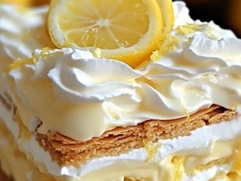 Florida's No-Bake Lemon Eclair Cake: A Taste of Sunshine - NewsBreak Lemon Eclair Cake No Bake, No Bake Lemon Eclair Cake, Penuche Fudge, Cheesecake Mousse Recipe, Lemon Raspberry Cheesecake, Southern Caramel Cake, Carrot Cake With Pineapple, Caramel Cake Recipe, Banana Split Cake