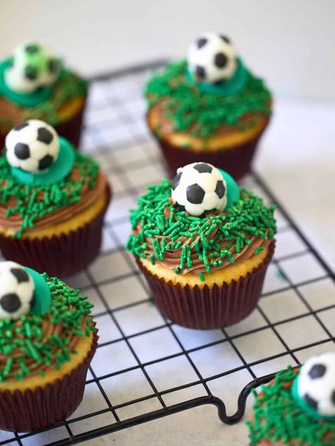 This Soccer Cupcake recipe is super easy, made with a box of cake mix and a delicious chocolate buttercream frosting. Topped with candy grass and a candy soccer ball, these cupcakes make a sweet treat for soccer-themed parties, end-of-season tournament celebrations and all things soccer! Soccer Ball Cupcakes, Soccer Cupcake Ideas, Granddaughters Birthday, Soccer Treats, Soccer Cupcakes, Sport Cupcakes, Cupcake Carrier, Blue Frosting, Soccer Cake