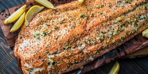 Get hooked on this grilled garlic salmon recipe. Simply brush on a garlic, parsley and olive oil mixture on the filet, toss it on the grill, and let our wood-fired flavor do the rest. Vegetable Cocktails, Smoked Salmon Recipes, Garlic Salmon, Griddle Recipes, King Salmon, Traeger Recipes, Pellet Grill Recipes, Wood Pellet Grills, Salmon Seasoning