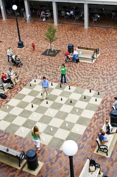 Giant chess board in the Iowa City pedestrian mall - Iowa Giant Chess Board, Iowa Road Trip, Playgrounds Architecture, Giant Chess, Urban Playground, New Urbanism, Urban Landscape Design, Us Road Trip, Interactive Installation