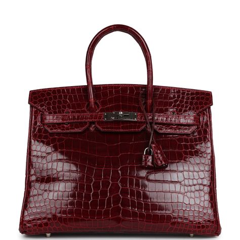 This Birkin 35 is in Rouge H Shiny Porosus crocodile leather with Palladium hardware, tonal stitching, a front flap with two straps, front toggle closure, clochette with lock and two keys, and double rolled handles.The interior is lined in Rouge H chevre leather and has one zip pocket with an Hermes engraved zipper pull and an open pocket on the opposite side.Collection: I squareOrigin: FranceCondition: Pre-owned -Excellent; This bag retains it shape. No plastic on hardware. Moderate scratching Red Birkin Bag, Birkin Purse, Red Birkin, Hermes Crocodile Bag, Birken Bag, Vintage Hermes Bag, Hermes Crocodile, Hermes Birkin Bag, Birkin Bags