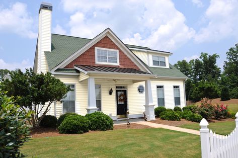 Green roofs can look charming and elegant for your home’s curb appeal. But not matching the paint to a green roof can cause a clashing design. Also, y... | 15 House White Shutter Paint Colors, Cedar Shingle Siding, Green Roof House, Painted Brick Exteriors, Tan House, Shutter Colors, Exterior Color Palette, Green Shutters, White Siding