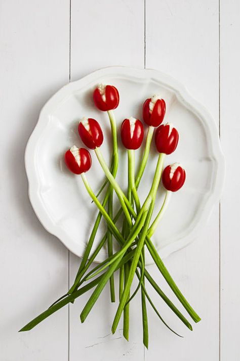 These pretty tulip tomato appetizers practically spring into bloom, they're so easy to assemble. Tomato Tulips, Easy Easter Dinner Recipes, Easter Appetizers Easy, Easy Easter Dinner, Easter Dinner Menus, Easter Food Appetizers, Easter Appetizers, Easter Menu, Easter Dinner Recipes