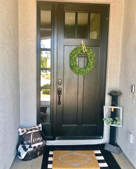 Natural light can be welcomed into an entryway with sidelights installed on one or both sides of a front door. This allows the door to have a limited number of glass panels or none at all. Accessorize a solid door with a simple wreath and layered door mats to make it more inviting. Black Front Doors With One Sidelight, Front Door With Left Sidelight, Single Side Light Front Door, Front Door With Right Sidelight, Side Doors Entrance Ideas, Front Door Single Sidelight, Front Doors With One Side Light, Front Door With One Side Panel, Front Door No Sidelights