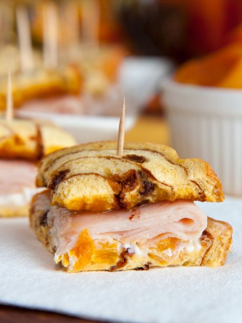 These sweet-and-savory creations are perfect for your snacking needs. The sweet: cinnamon raisin swirl, dried apricots, apricot jam, and honey. The savory: Dijon mustard, smoked turkey, and tangy cream cheese. These sandwiches are a fun alternative to a classic turkey sandwich. Swirl Bread Recipe, Turkey Sandwiches Recipes, Potato Rolls, Types Of Sandwiches, Turkey Sandwich, Cinnamon Raisin Bread, Potato Roll, Butter Bread, Swirled Bread