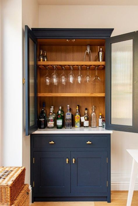 Read all about this project's bespoke kitchen cabinetry, including this breakfast larder with bifold doors and a bespoke drinks dresser featuring reeded glass cabinetry doors😍😍😍 Dining Room Dresser, Modern Kitchen Cupboards, Navy Cabinets, Herringbone Kitchen, Kitchen Bar Design, Home Bar Cabinet, Modern Home Bar, Cool Coffee, Kitchen Cupboard Designs