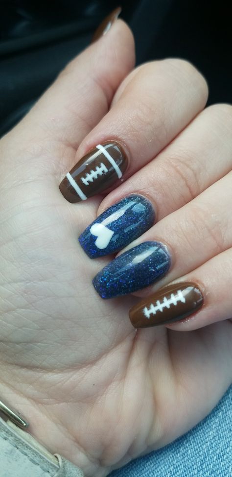 We are . . . Penn State! Football nails #football #psu #pennstate Basketball Acrylic Nails, Football Nails With Number, Football Acrylic Nails, Football Season Nail Designs, Blue And Gold Football Nails, Sport Nail Designs, Fall Football Nail Designs, Penn State Nails Designs, Football Inspired Nails