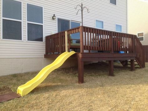 play structure on sloped yard - Yahoo Search Results Deck With A Slide, Backyard Slide On Hill, Slide On Deck, Slide Off Of Deck, Slide Off Deck, Play Set Landscaping, Deck With Slide, Deck Playground, Playset Landscaping