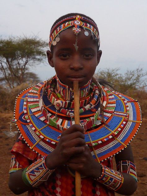 Masai Mara, Kenya. In every tribe, the male Masai pass through three main life stages- boyhood, warrior-hood and elder-hood. Masai Tribe Art, Kenya Clothing, Masai Art, Masai Tribe, Maasai People, Masai Mara Kenya, Blue Yellow Orange, Wedding Necklaces, Bridal Outfit