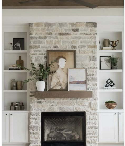 Stone Fireplace With White Built Ins, Brick Vs Stone Fireplace, Cottage Fireplace Ideas Farmhouse Style, How To Stone A Fireplace, Built Ins With Stone Fireplace, Stone Fireplace With Arched Built Ins, Styling A Stone Fireplace Mantle, Fireplace With Small Windows On Sides, Stone Fireplace With Sconces