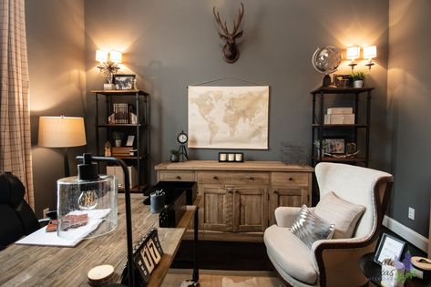 Rustic, masculine, sportsman's office redesign. We used deconstructed chairs, rustic desk and furnishings to add the right amount of "hunter" touch to this space. It has an industrial office vibe with wrought iron. Texas style is added with a hair on hide rug and iron finishes. Western Inspired Office, Dark Walls Office, Pastor Office Ideas, Vintage Farmhouse Office, Western Home Office, Western Office Decor Ideas, Rustic Office Ideas, Masculine Office Ideas, Deconstructed Chairs