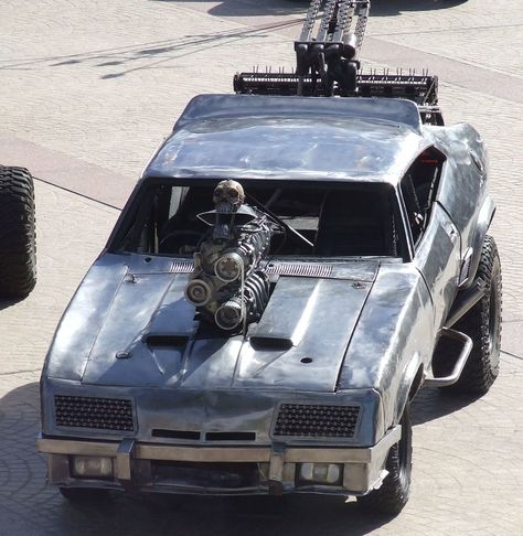 The V8 Interceptor, also known as a Pursuit Special, is driven by Max Rockatansky at the end of Mad Max and for the first half of Mad Max 2: The Road Warrior. It is based on a 1973 Ford Falcon XB GT coupe, which was modified to become a police interceptor by the Main Force Patrol. The vehicle also makes an appearance in Mad Max: Fury Road and is later modified into an off-road bare metal version called the Razor Cola. Note: Plot Spoilers Below V8 Interceptor, Mad Max 2, Max Rockatansky, Overland Gear, The Road Warriors, Car Max, Atv Accessories, Mad Max Fury, Mad Max Fury Road