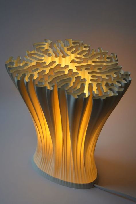 #ad

Materials: cornstarch based biopolymer

Width: 23 centimeters
Height: 24 centimeters
Depth: 20 centimeters

The lampshade is made of a warm white corn starch-based biopolymer and is biodegradable according to ISO 14855. It can be easily separated from the base of the lamp thanks to its magnetic connection and is robust and waterproof, making it easy to clean. It comes with an E14 lamp socket and an extra warm white, energy-efficient LED. Lamp 3d Print, Curvy Lamp, Lamp Design Creative, Organic Lamp, Metal Lamp Design, Reaction Diffusion, Coral Polyps, 3d Printed Lamp, Bio Design